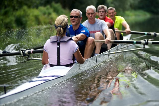 Trainee rowers on the water during on learn to row course.