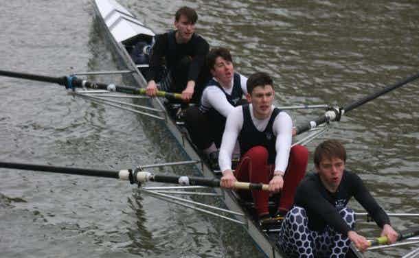 The men’s novice coxed four, looking tired on the smooth green water. 