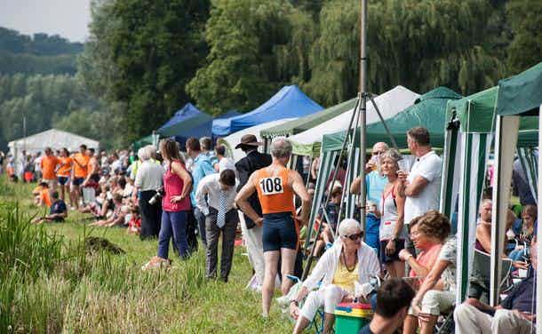 Spectators, competitors, and mainly gazeboes amass on the bank at our regatta.